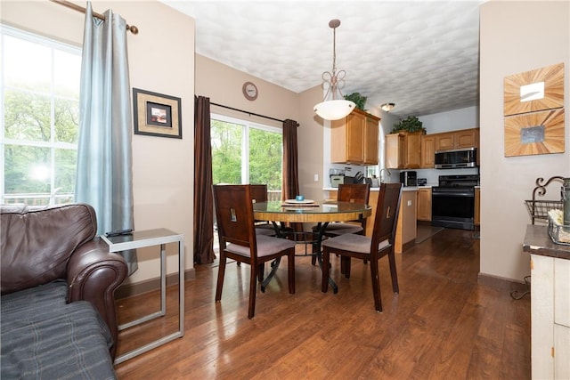 21 Fieldstone Dr, Coventry, RI 02816 - dining room featuring dark wood finished floors and baseboards