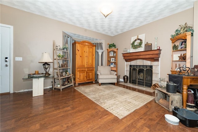 21 Fieldstone Dr, Coventry, RI 02816 - living area featuring wood finished floors, a tile fireplace, and baseboards