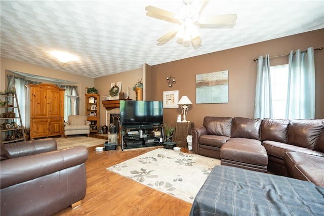 21 Fieldstone Dr, Coventry, RI 02816 - living area with wood finished floors and a ceiling fan
