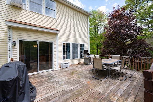 21 Fieldstone Dr, Coventry, RI 02816 - wooden terrace with outdoor dining space, a grill, and a wall mounted AC