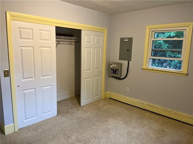 10 Cavalier Rd, Narragansett, RI 02882 - unfurnished bedroom featuring electric panel, a baseboard heating unit, a closet, and light colored carpet