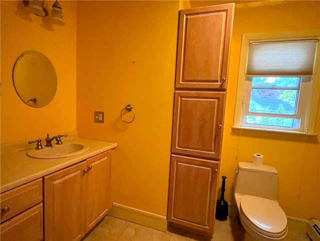10 Cavalier Rd, Narragansett, RI 02882 - bathroom featuring vanity, a baseboard radiator, toilet, and baseboards