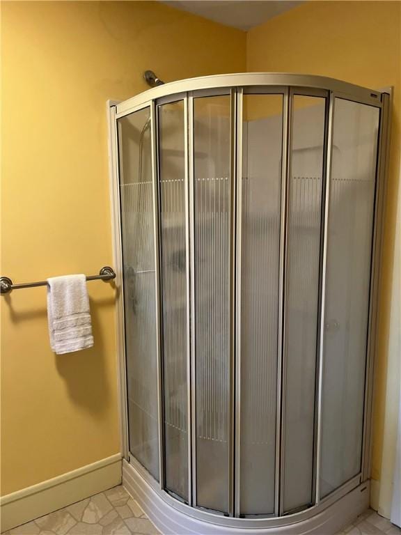 10 Cavalier Rd, Narragansett, RI 02882 - full bathroom with a stall shower and baseboards