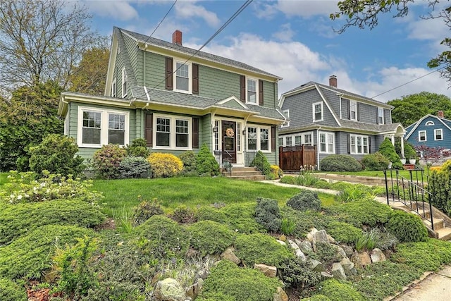 77 Glen Ave, Cranston, RI 02905 - view of front of home with a chimney