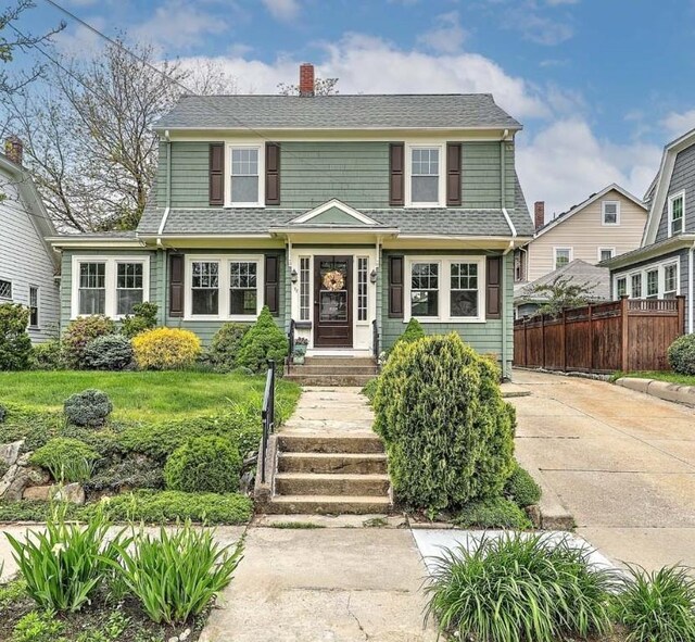 77 Glen Ave, Cranston, RI 02905 - view of front of home featuring a chimney and a shingled roof