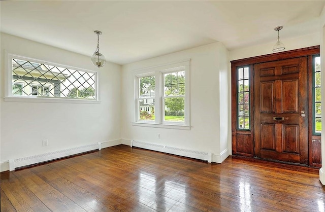 77 Glen Ave, Cranston, RI 02905 - foyer entrance featuring a baseboard heating unit, baseboards, and dark wood-type flooring