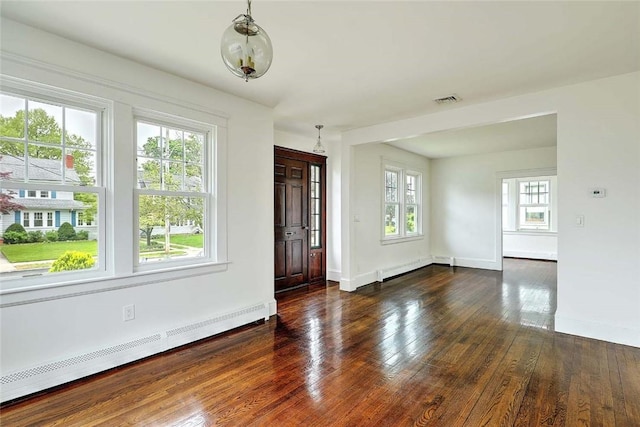 77 Glen Ave, Cranston, RI 02905 - entrance foyer featuring baseboard heating, hardwood / wood-style floors, and baseboards