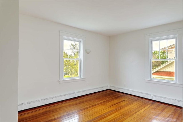 77 Glen Ave, Cranston, RI 02905 - unfurnished room with plenty of natural light, wood-type flooring, and baseboard heating