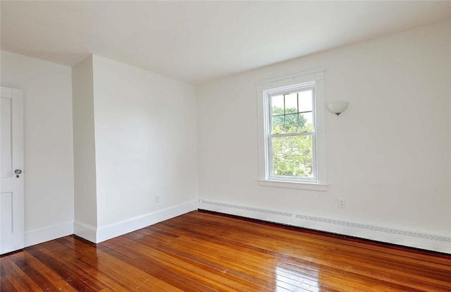 77 Glen Ave, Cranston, RI 02905 - unfurnished room with hardwood / wood-style flooring, baseboard heating, and baseboards