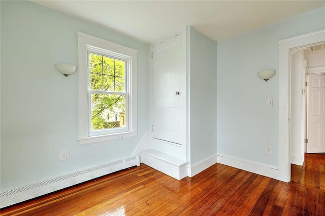 77 Glen Ave, Cranston, RI 02905 - unfurnished room featuring a baseboard radiator, hardwood / wood-style flooring, and baseboards