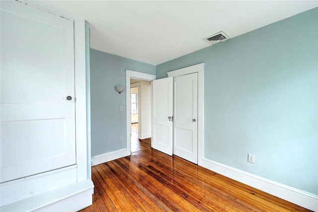 77 Glen Ave, Cranston, RI 02905 - unfurnished bedroom with baseboards, wood finished floors, and a closet