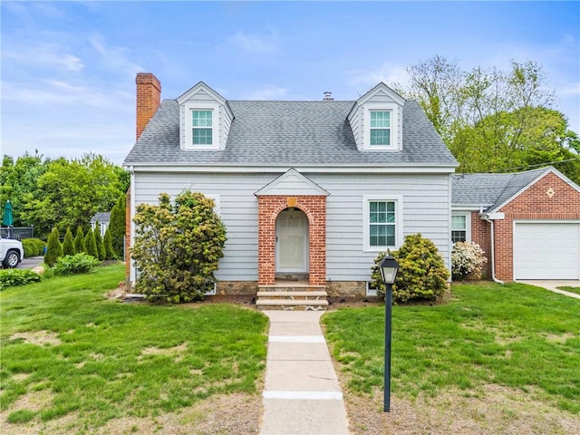 12 Arlington St, Westerly, RI 02891 - new england style home with a chimney, entry steps, a front yard, an attached garage, and a shingled roof