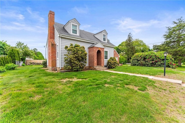 12 Arlington St, Westerly, RI 02891 - new england style home featuring a chimney and a front lawn