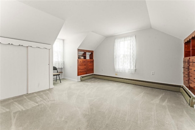 12 Arlington St, Westerly, RI 02891 - additional living space with lofted ceiling, carpet, and a baseboard heating unit