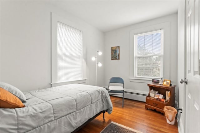 12 Arlington St, Westerly, RI 02891 - bedroom featuring baseboard heating and wood finished floors