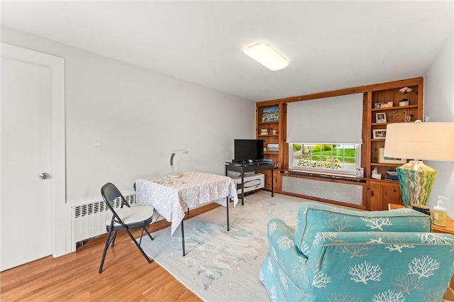 12 Arlington St, Westerly, RI 02891 - living room featuring radiator, wood finished floors, and built in shelves