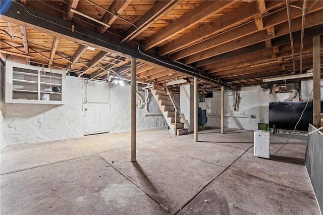 12 Arlington St, Westerly, RI 02891 - unfinished below grade area with oil tank and stairs