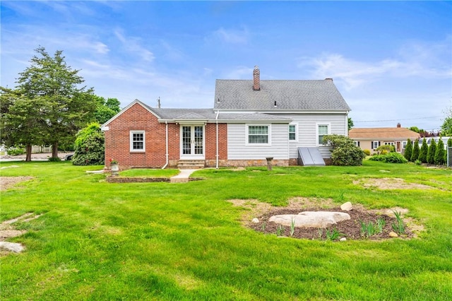 12 Arlington St, Westerly, RI 02891 - rear view of house featuring french doors, a yard, a chimney, and entry steps