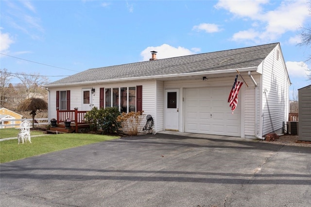 4 Aberdeen St, West Warwick, RI 02893 - single story home with a garage, asphalt driveway, cooling unit, and a shingled roof