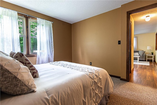 417 Privilege St, Woonsocket, RI 02895 - bedroom featuring a textured ceiling, baseboards, and carpet floors
