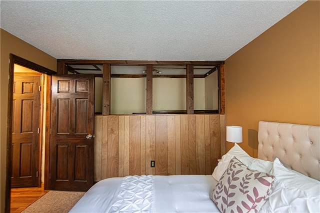 417 Privilege St, Woonsocket, RI 02895 - bedroom featuring a textured ceiling and wood finished floors