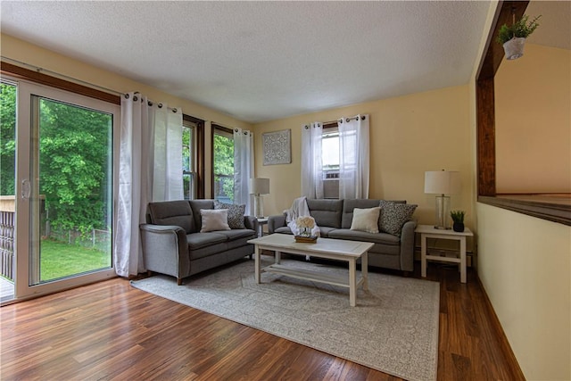417 Privilege St, Woonsocket, RI 02895 - living area with a textured ceiling and wood finished floors