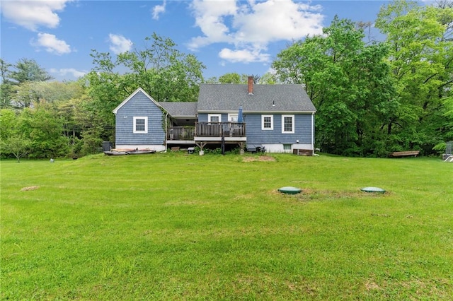 223 Chopmist Hill Rd, Glocester, RI 02814 - rear view of house featuring a deck, a lawn, and a chimney