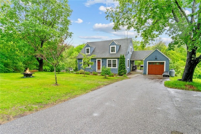 223 Chopmist Hill Rd, Glocester, RI 02814 - cape cod home with an attached garage, a front yard, driveway, a fire pit, and an outbuilding