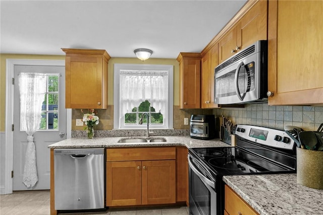 223 Chopmist Hill Rd, Glocester, RI 02814 - kitchen featuring appliances with stainless steel finishes, a sink, tasteful backsplash, and light stone counters