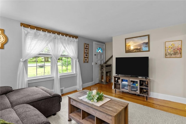 223 Chopmist Hill Rd, Glocester, RI 02814 - living room featuring baseboards, wood finished floors, and stairs