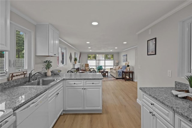 120 Aspinet Dr, Warwick, RI 02888 - kitchen with a sink, dishwasher, crown molding, a peninsula, and light wood-style floors