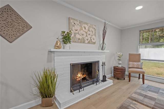 120 Aspinet Dr, Warwick, RI 02888 - sitting room featuring a brick fireplace, ornamental molding, wood finished floors, baseboards, and recessed lighting