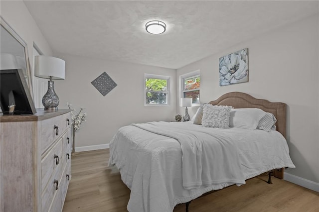 120 Aspinet Dr, Warwick, RI 02888 - bedroom with baseboards and wood finished floors