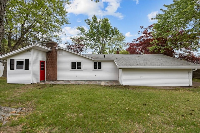 120 Aspinet Dr, Warwick, RI 02888 - back of house featuring a chimney, a yard, and a patio area
