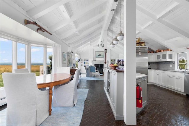 61 Baileys Ledge Rd, Little Compton, RI 02837 - dining space featuring a fireplace, brick floors, wood ceiling, and a baseboard heating unit