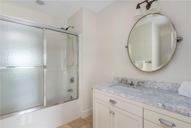 61 Baileys Ledge Rd, Little Compton, RI 02837 - bathroom featuring vanity, enclosed tub / shower combo, baseboards, and tile patterned floors