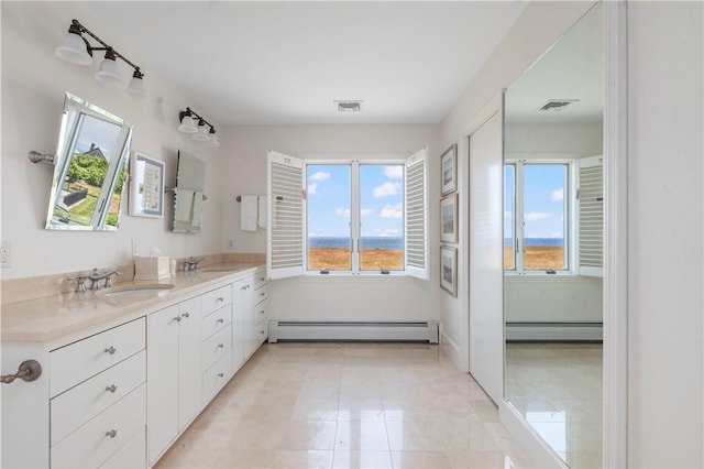 61 Baileys Ledge Rd, Little Compton, RI 02837 - full bathroom featuring baseboard heating, a baseboard radiator, plenty of natural light, and double vanity