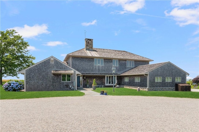 61 Baileys Ledge Rd, Little Compton, RI 02837 - rear view of house featuring a chimney and a yard