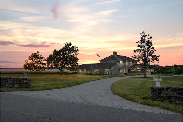 61 Baileys Ledge Rd, Little Compton, RI 02837 - view of front facade with a lawn and curved driveway