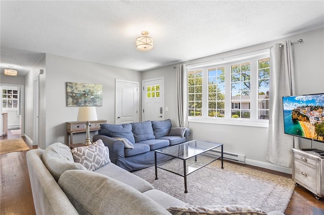 25 Old Pine Rd, Narragansett, RI 02882 - living room with a textured ceiling, baseboards, and wood finished floors
