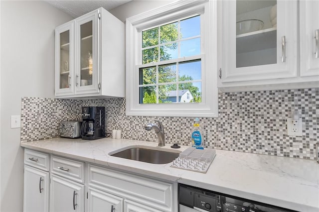 25 Old Pine Rd, Narragansett, RI 02882 - kitchen featuring a sink, white cabinetry, backsplash, and glass insert cabinets