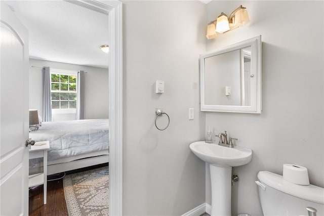 25 Old Pine Rd, Narragansett, RI 02882 - ensuite bathroom featuring toilet and wood finished floors