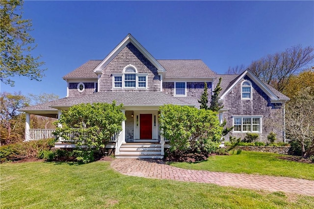 38 Westwind Dr, Jamestown, RI 02835 - shingle-style home with a front lawn, roof with shingles, and a porch