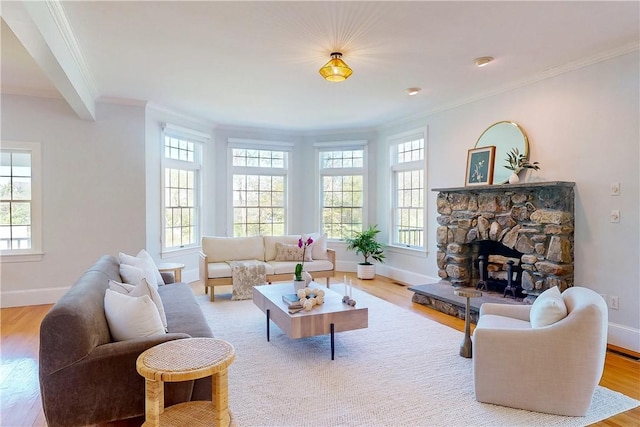 38 Westwind Dr, Jamestown, RI 02835 - living area with healthy amount of natural light, crown molding, wood finished floors, and baseboards