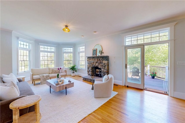 38 Westwind Dr, Jamestown, RI 02835 - living area featuring crown molding, light wood-style flooring, and baseboards