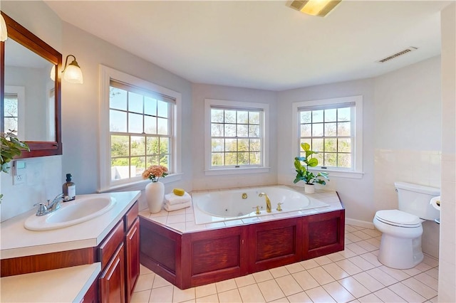 38 Westwind Dr, Jamestown, RI 02835 - full bath featuring toilet, tile patterned floors, a tub with jets, vanity, and baseboards