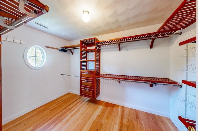38 Westwind Dr, Jamestown, RI 02835 - walk in closet featuring wood finished floors