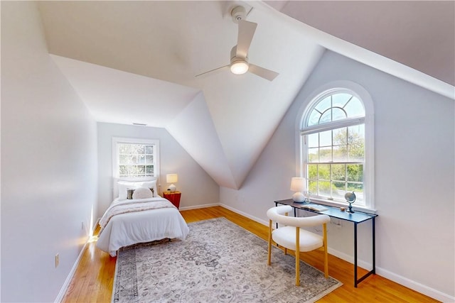 38 Westwind Dr, Jamestown, RI 02835 - bedroom with lofted ceiling, wood finished floors, ceiling fan, and baseboards