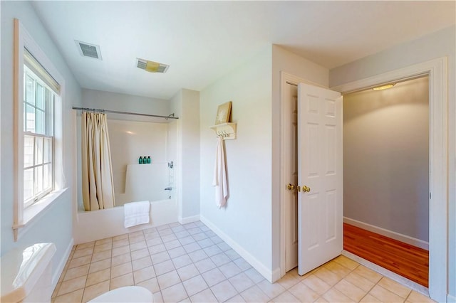 38 Westwind Dr, Jamestown, RI 02835 - full bathroom with shower / bath combo, tile patterned flooring, baseboards, and toilet