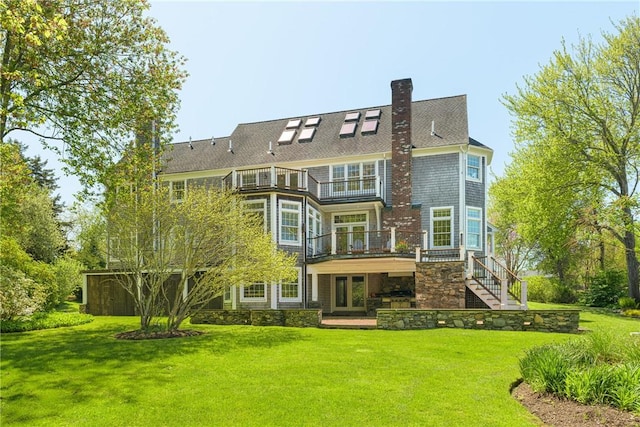 38 Westwind Dr, Jamestown, RI 02835 - rear view of property featuring a balcony, a yard, a chimney, and stairway